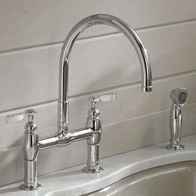 faucet mounted on counter top with sprayer